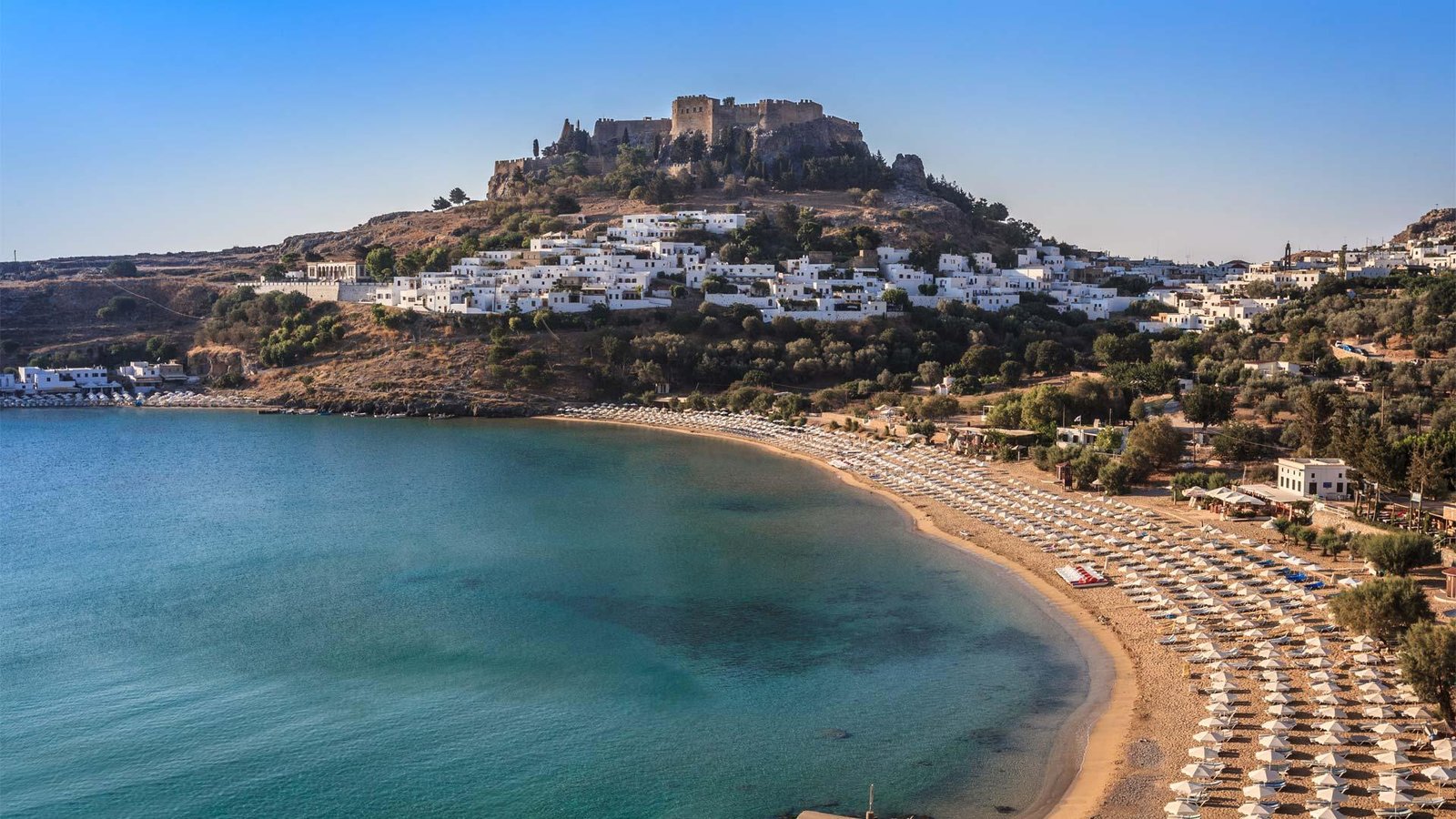 Lindos village and bay, Rhodes — dining with a view of the Acropolis